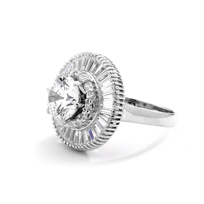 Ring round stone encircled by baguettes