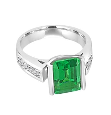 Sarabande - Impressive Ring with 4 Ct. Emerald Cut Emerald Essence Center and featuring Channel Set accents on the band. 5 Cts. T.W.
in 14K White Gold.