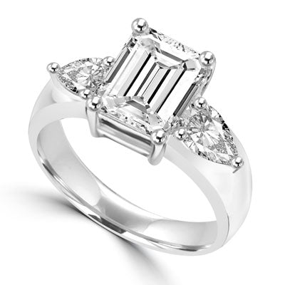 Brilliant Ring with 3 carat Radient Emerald Diamond Essence with 0.5 carat Pear cut Diamond Essence on each side. 4.0 cts.t.w. in 14K Solid White Gold.