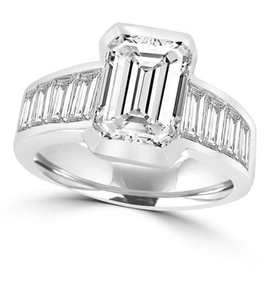 Escape with this Wide Band Ring with Channel Set Emerald Essence, 2.5 cts. separated by straight Diamond Bright Baguettes set vertically for a totally magnificent effect. 3.5 cts.T.W. set in 14K White Gold.