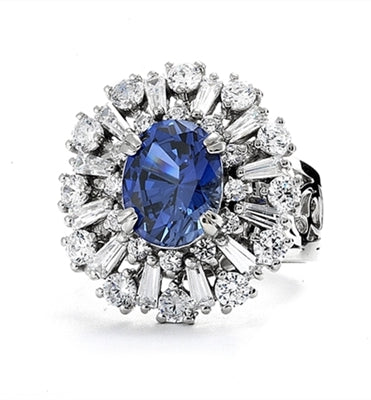 Diamond Essence Ring in 14K Solid White Gold with 2.5 carat Oval Sapphire Essence in the center, surrounded by Diamond Essence round stones and baguettes. Appx. 4.5 cts.t.w. on designer wide band. Just perfect for all occasions.