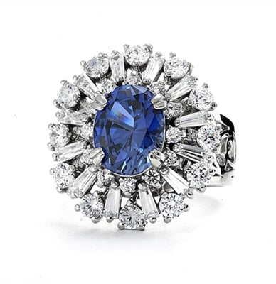 Diamond Essence Ring in 14K Solid White Gold with 2.5 carat Oval Sapphire Essence in the center, surrounded by Diamond Essence round stones and baguettes. Appx. 4.5 cts.t.w. on designer wide band. Just perfect for all occasions.