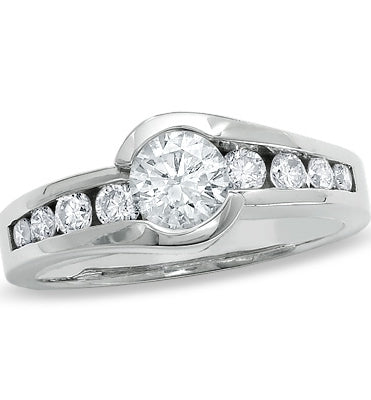 Designer Ring with channel set, 1.0 Cts. Round Brilliant Diamond Essence in center accomapnied by graduating melee on either side, 1.30 Cts. T.W. 14K Solid White Gold.