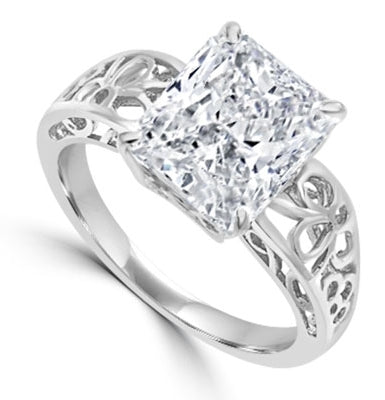 In this finely created ring, a 4 Ct. Radiant Emerald White Brilliant Stone is crafted atop an ethic set wide band. In 14k Solid Yellow Gold.