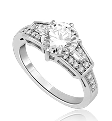 Mesmerizing 2.0 Ct Brilliant stone is adorned by superbly crafted Baguettes and Round Melee forming 2.5 Cts. T.W. In 14k Solid White Gold.