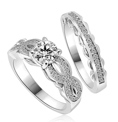 Wedding Set- 1.0 Ct. Round Brilliant Diamond Essence in center with Melee set in intervening design on either side and wedding band with delicately set Melee. 1.35 Cts. T.W. set in 14K Solid White Gold.