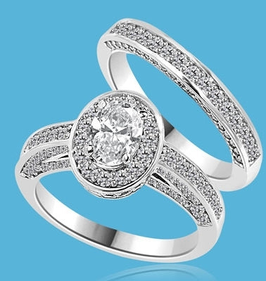 Wedding Set--1.0 ct. Oval cut Diamond Essence set in the center with melee around. Matching band with Melee. 2.50 cts.t.w. in14K Solid White Gold.