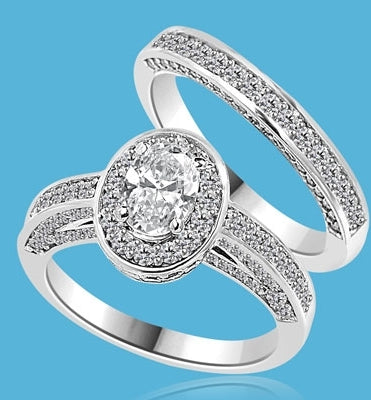 Wedding Set--1.0 ct. Oval cut Diamond Essence set in the center with melee around. Matching band with Melee. 2.50 cts.t.w. in14K Solid White Gold.