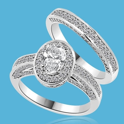 Wedding Set--1.0 ct. Oval cut Diamond Essence set in the center with melee around. Matching band with Melee. 2.50 cts.t.w. in14K Solid White Gold.