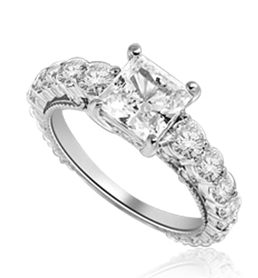 Engagement Ring With Princess Cut Diamond Essence Set in Center accompanied by Round Brilliant Diamond Essence going down the band. 3.25 Cts. T.W. set in 14K Solid White Gold.