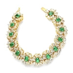 7" long Diamond Essence Bracelet with Emerald cut 13 Emerald Essence,each 1ct, surrounded by Marquie, Pear and Round stones. Appx. 38.0 Cts. T.W. set in 14K Solid Yellow Gold.