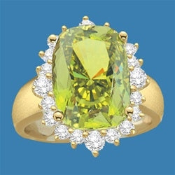 Ring with a oval cut 8.0 cts. Diamond Essence Peridot at the center, surrounded by round Diamond Essence stones, 9.0 cts.T.W. set in 14K Solid Yellow Gold.