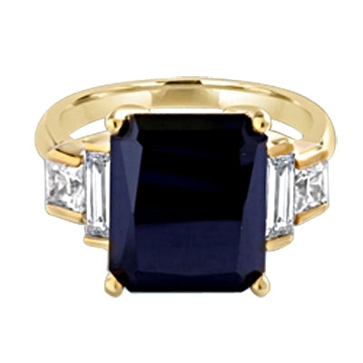 Onyx Ring - 6.0 Cts. Radiant Emerald cut Onyx Essence set in four prongs, accompanied by channel set Diamond Essence Baguettes and Princess cut stones on either side. 7.0 Cts.T.W. set in 14K Solid Yellow Gold.