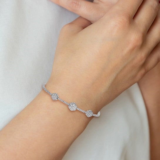 A majestic looking designer adjustable bracelet in a prong setting with artificial round brilliant diamonds by Diamond Essence set in platinum plated sterling silver. Total 133 stones.