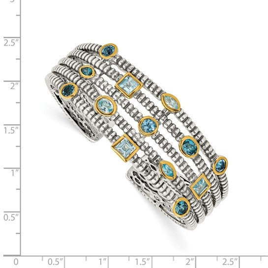 Wide cuff bracelet with diamond essence sky blue and london topaz stones in bezel setting