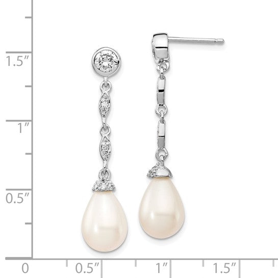 Diamond Essence Designer Earring with round brilliant melee and 8mm Pearl. Perfect for all occasions, 1.40 cts. t.w. in Platinum Plated Sterling Silver.