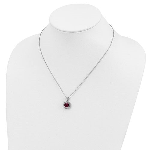 Diamond and Ruby Pendant - 2.0 cts. Round Ruby Essence in center surrounded by princess Cut Diamond Essence and Melee. 5.5 Cts. T.W. set in Platinum Plated Sterling Silver.
