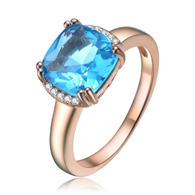 Diamond Essence Designer Ring with 2.5 carat Aquamarine Cushion Essence in 8 prongs setting and delicate melee set on two sides of cushion essence for additional beauty.2.60 Cts.T.W. in Rose Plated Sterling Silver.