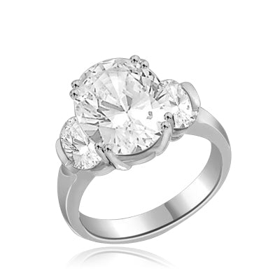 oval cut stone in center and side in silver ring