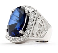 Tiger Imprinted with For the king of the jungle, this authoritative mens ring has a deep-blue oval Sapphire Essence, 5.45 cts., in the center, flanked by Diamond Essence melee in 14K White Gold, with tigers imprinted in Gold on either side. 8.45 cts. t.w