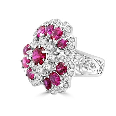 A beautiful ring in floral design. Diamond Essence ruby and round brilliant masterpieces.5.0 cts. T.W. set in Platinum Plated Sterling Silver. A perfect party wear to get compliments.