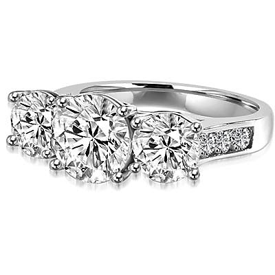 Impressive Three Stone Ring with artistically set triple Diamond Essence stones on the band, an enchanting 4.0 Cts.T.W. in Platinum Plated Sterling Silver.