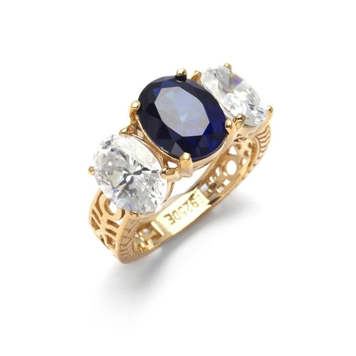 Ovalinas - Three Stone Oval Ring with 2 Ct. Oval Masterpiece on an Ethnic Band and 1.5 Ct.Oval Essence on each side, 5 ct t.w. in 14K Gold Vermeil. Center Stone changeable to Many Options.