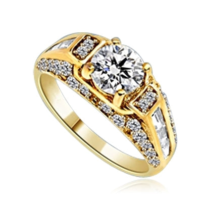 Engagement Ring- 1.0 Ct. round Brilliant Diamond Essence in center with Chanel set Baguettes and Melee going half way down the band. 2.0 Cts. T.W. set in 14K Gold Vermeil.