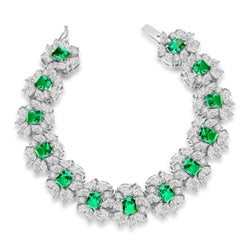 7" long Diamond Essence Bracelet with Emerald cut 13 Emerald Essence,each 1ct, surrounded by Marquie, Pear and Round stones. Appx. 38.0 Cts. T.W. set in 14K Solid White Gold.