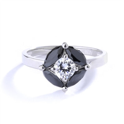 Ring - round-cut diamond is surrounded by marquise-cut black onyx